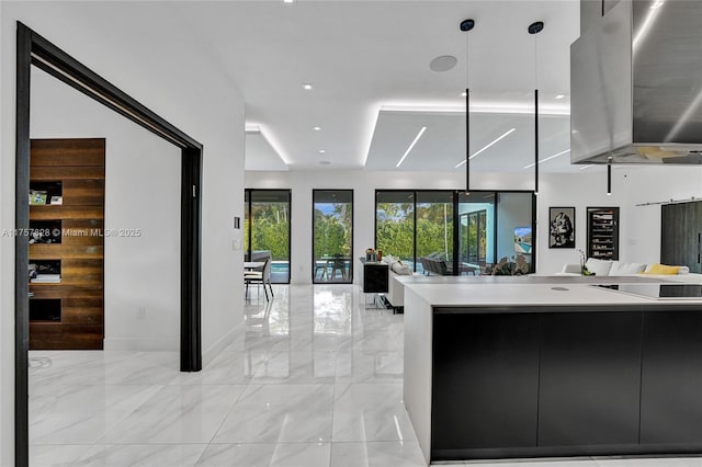 kitchen featuring marble finish floor, modern cabinets, open floor plan, and light countertops