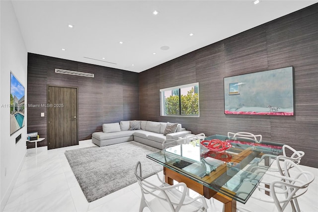 living room with recessed lighting, baseboards, and light tile patterned floors