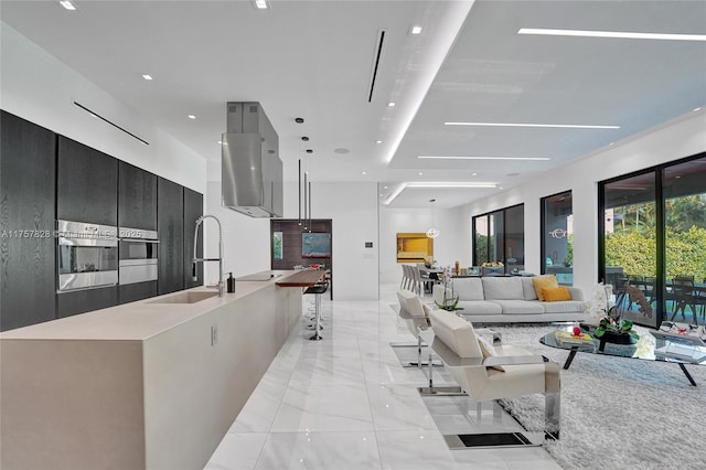 living room featuring marble finish floor and recessed lighting