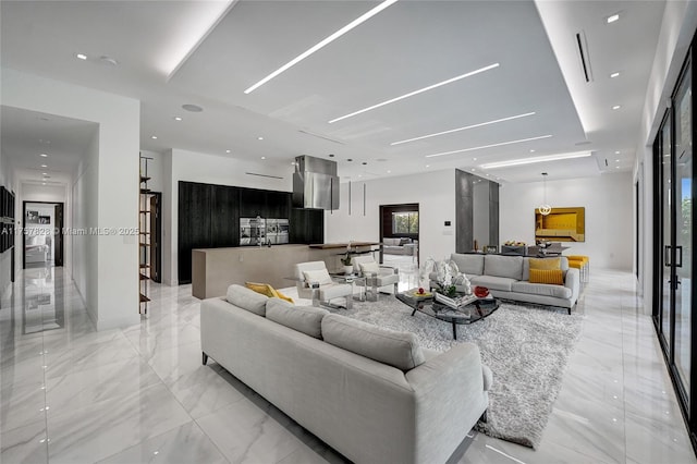 living room with marble finish floor and recessed lighting