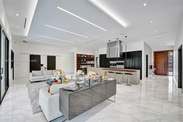 living area with recessed lighting, marble finish floor, and visible vents