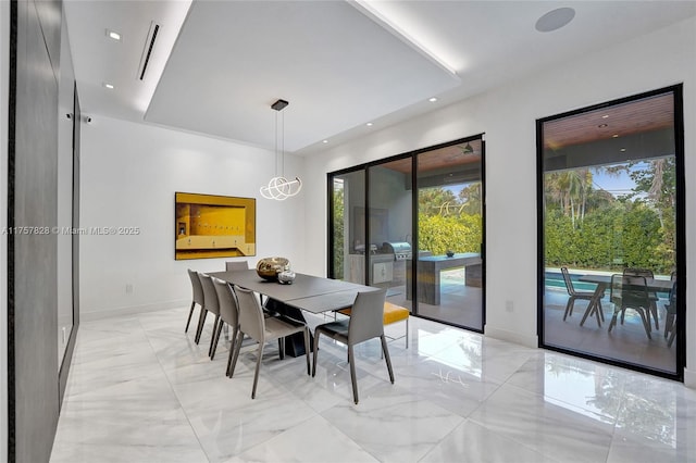 dining space with recessed lighting, marble finish floor, and baseboards