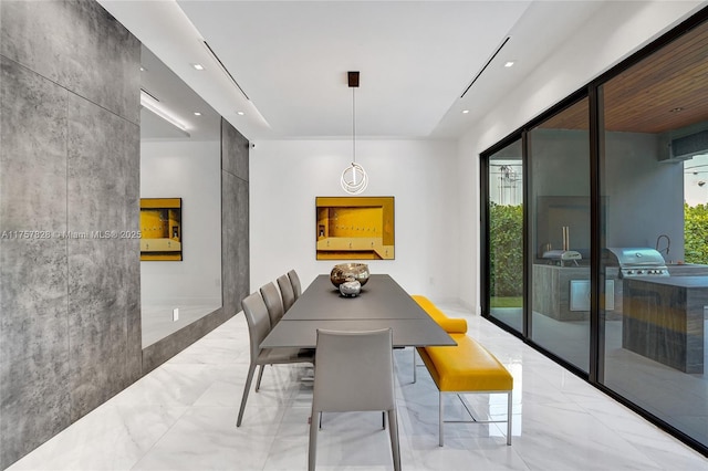 dining room with marble finish floor and recessed lighting