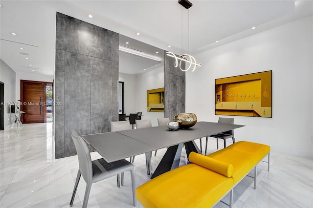 dining area with marble finish floor and recessed lighting