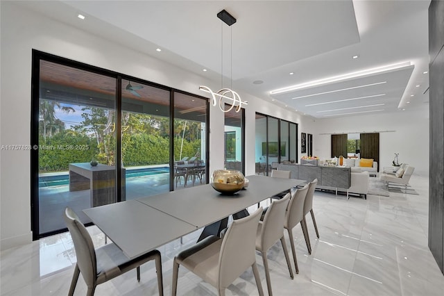 dining area featuring marble finish floor, a wealth of natural light, and recessed lighting