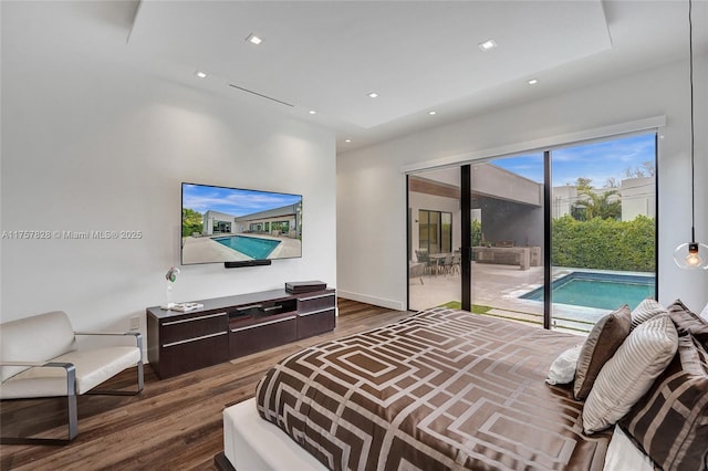 bedroom with baseboards, access to outside, wood finished floors, and recessed lighting