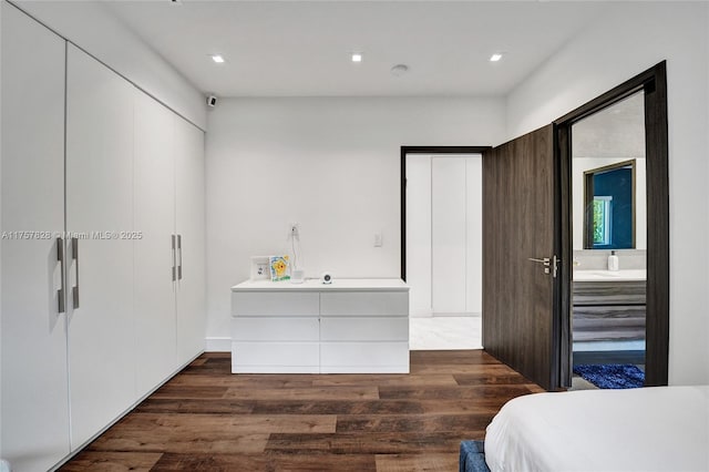 bedroom featuring wood finished floors and recessed lighting