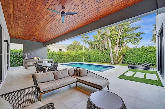 view of patio featuring outdoor dining space, an outdoor pool, outdoor lounge area, and ceiling fan