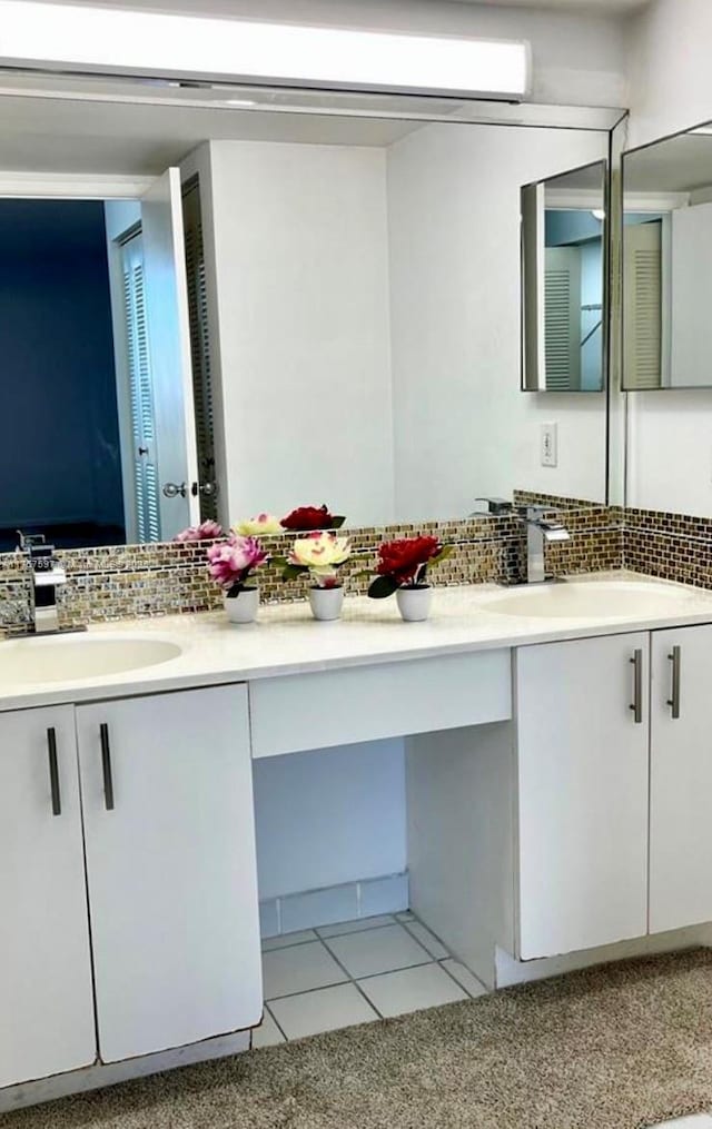 bathroom featuring backsplash, vanity, and tile patterned floors