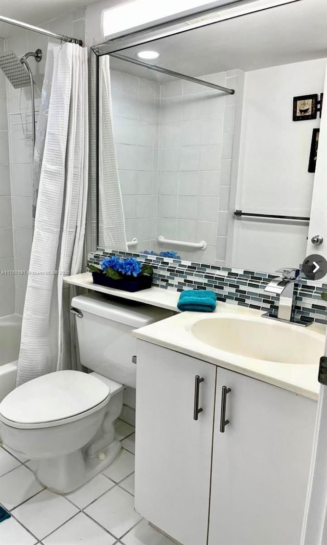 full bath with tile patterned flooring, toilet, vanity, backsplash, and shower / tub combo with curtain