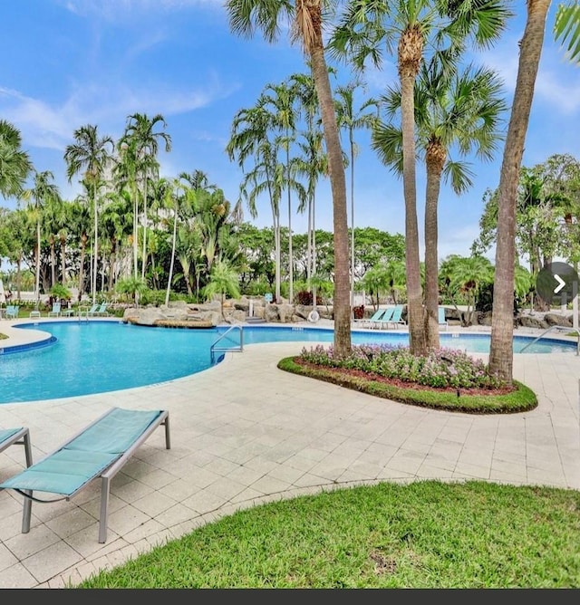 community pool with a patio