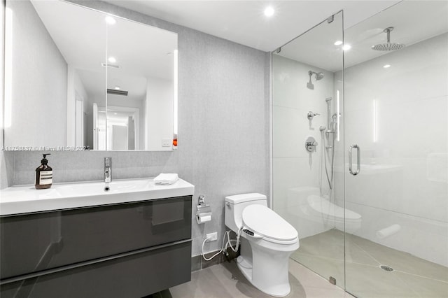 bathroom with toilet, a stall shower, visible vents, and vanity