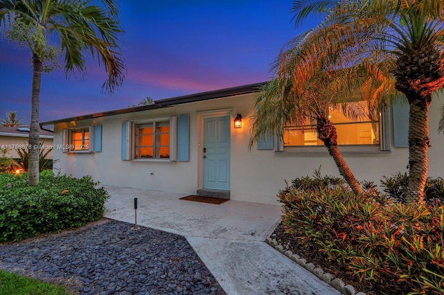 view of front of home featuring stucco siding