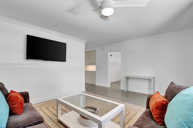 living room featuring visible vents, ornamental molding, ceiling fan, tile patterned flooring, and baseboards