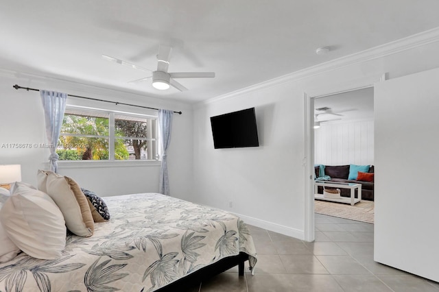 bedroom with ornamental molding, a ceiling fan, baseboards, and light tile patterned floors