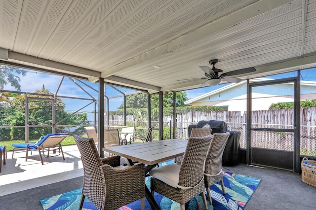 sunroom / solarium with a ceiling fan