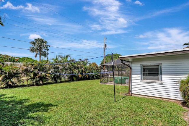 view of yard with a lanai