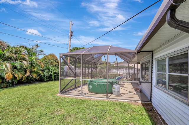 view of yard featuring a patio area, a lanai, and a pool