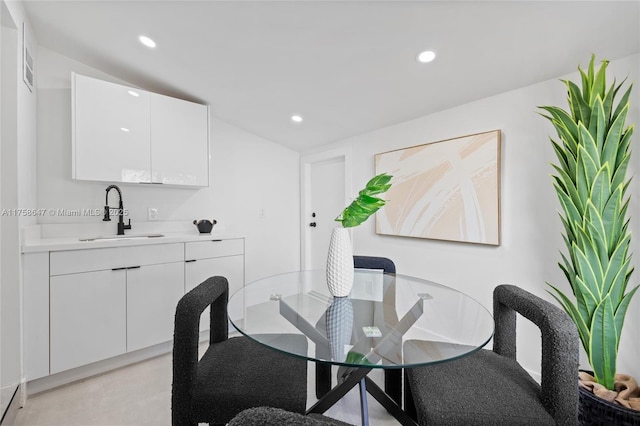 dining space featuring recessed lighting