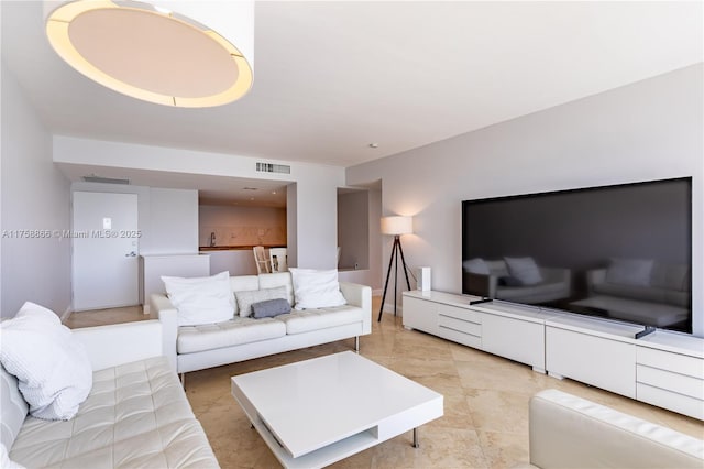 living room with visible vents and baseboards