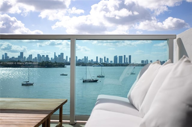 balcony with a water view and a city view