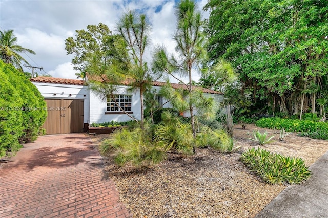 mediterranean / spanish house with a tile roof