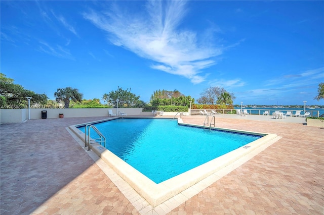 community pool with a patio