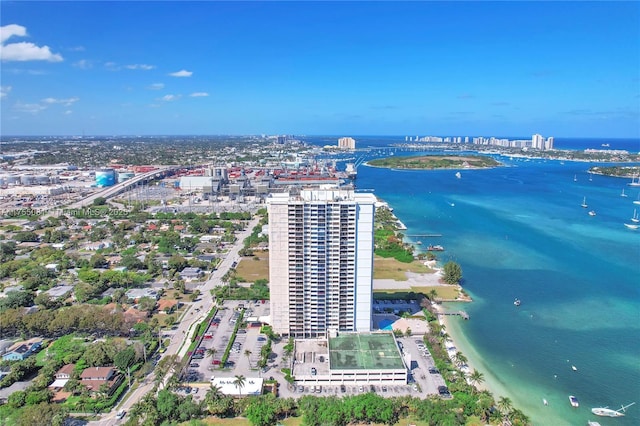 birds eye view of property featuring a water view and a city view