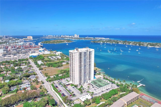 birds eye view of property featuring a view of city and a water view