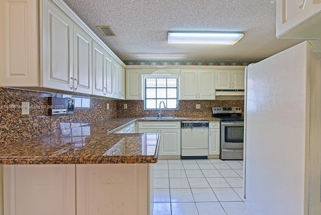 kitchen with electric range, visible vents, white dishwasher, under cabinet range hood, and a sink