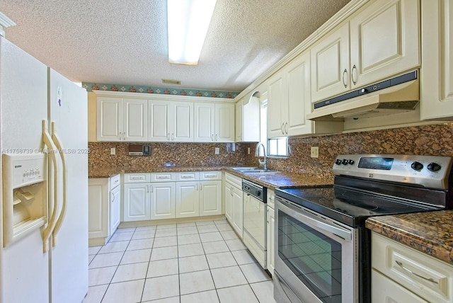 kitchen featuring white refrigerator with ice dispenser, dishwashing machine, stainless steel range with electric cooktop, under cabinet range hood, and a sink