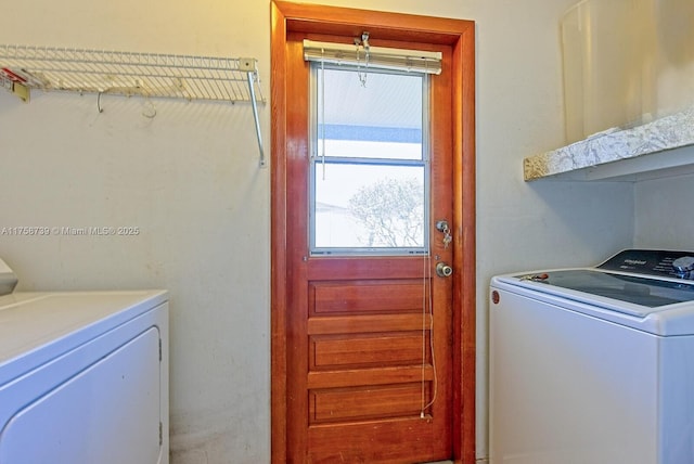 washroom with laundry area and separate washer and dryer