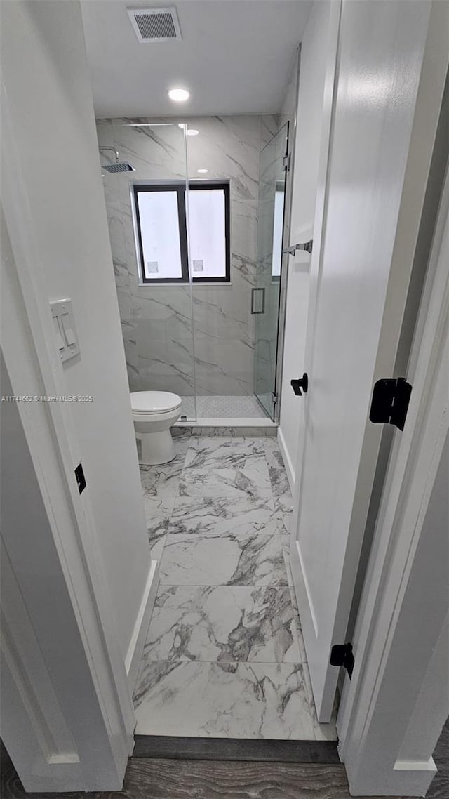 bathroom featuring a marble finish shower, visible vents, toilet, marble finish floor, and recessed lighting