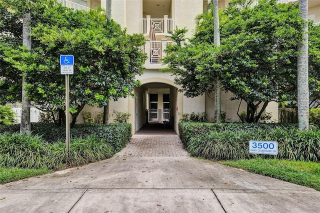 property entrance featuring french doors and stucco siding