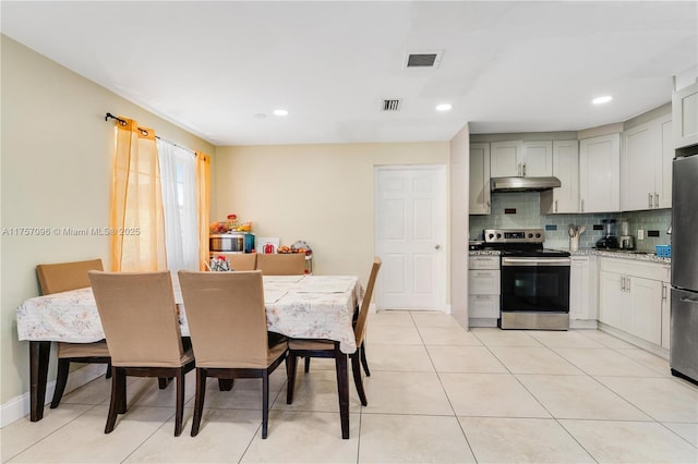 dining area featuring baseboards, light tile patterned flooring, visible vents, and recessed lighting