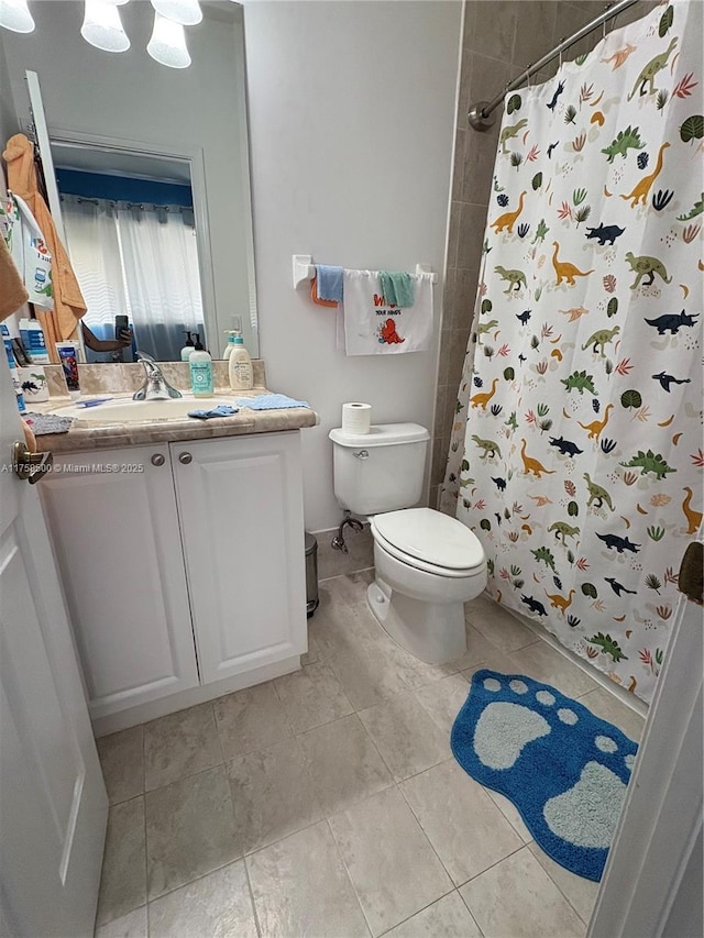 full bath featuring tile patterned flooring, a shower with shower curtain, toilet, and vanity