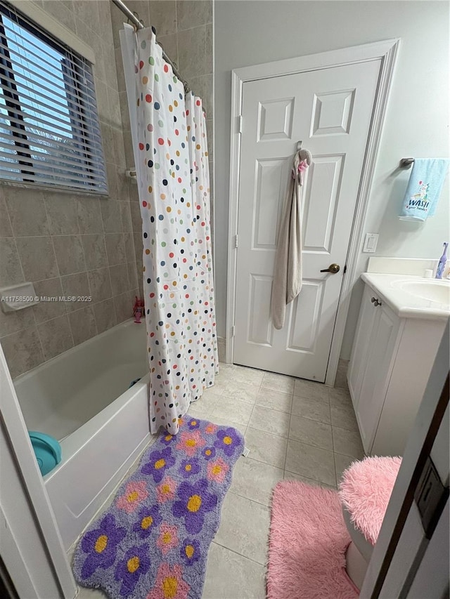 full bathroom with tile patterned floors, shower / bath combination with curtain, and vanity