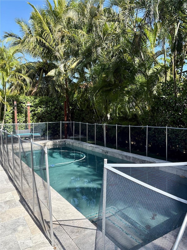 view of pool featuring fence and a fenced in pool