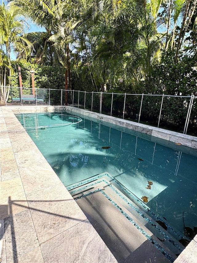 view of pool with fence and a fenced in pool