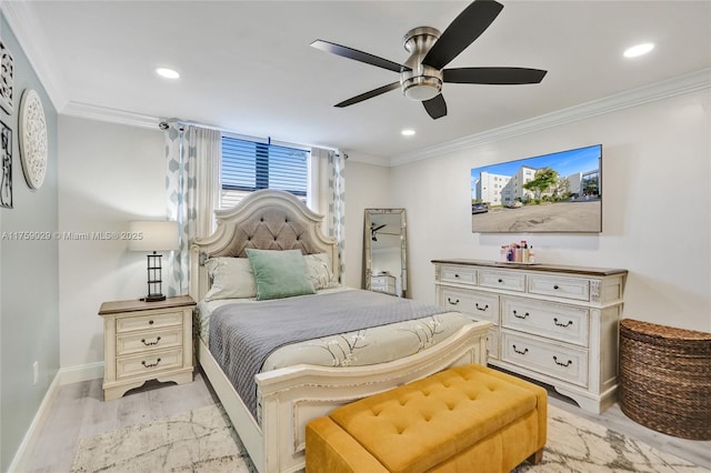 bedroom with crown molding, light wood-style flooring, and baseboards