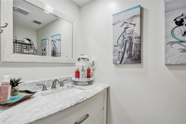 bathroom featuring vanity and visible vents