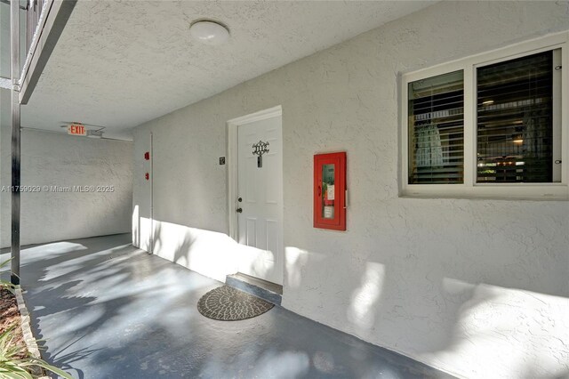 garage featuring a textured wall