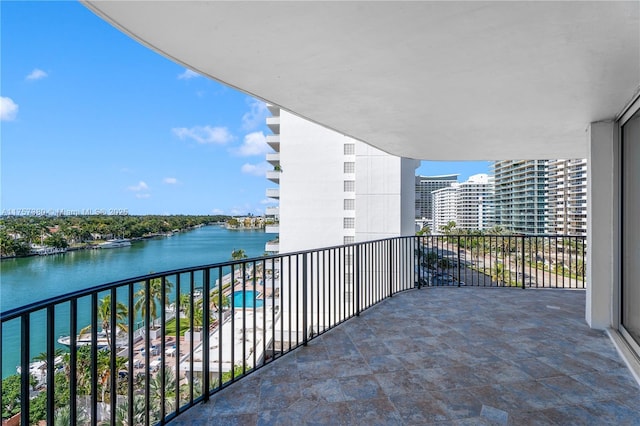 balcony featuring a water view