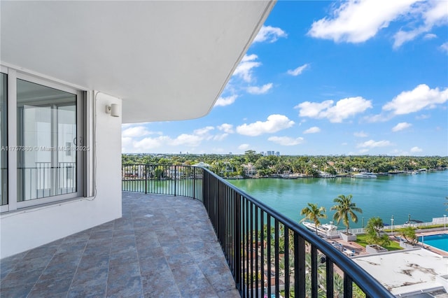 balcony featuring a water view