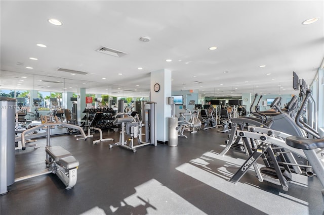 exercise room featuring recessed lighting and visible vents