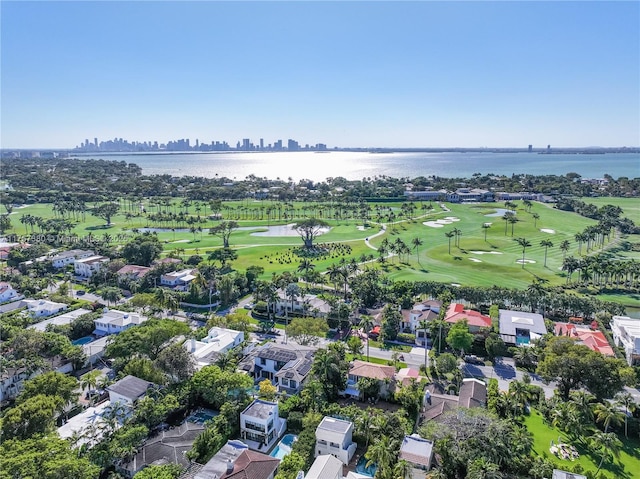 bird's eye view with a water view and golf course view