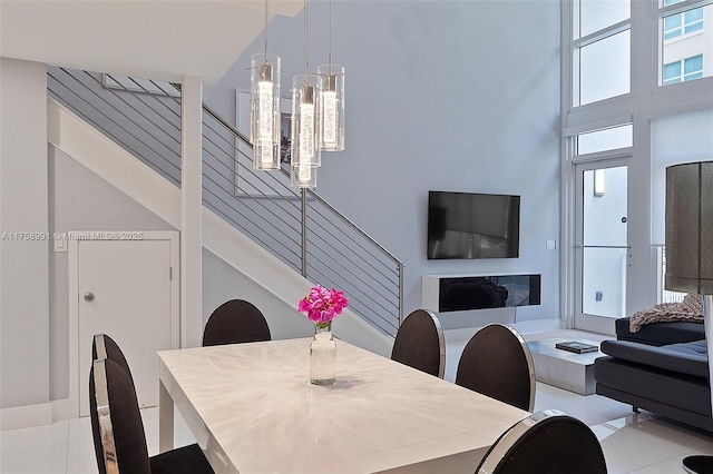 2020 N Bayshore Dr Unit Th 104, Miami, FL 33137 - tiled dining area with a towering ceiling and stairs