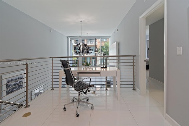 home office with visible vents, baseboards, a notable chandelier, and tile patterned floors