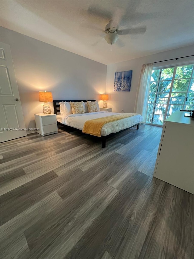 unfurnished bedroom with access to outside, ceiling fan, and wood finished floors