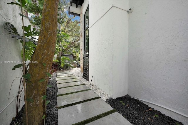 view of side of property with stucco siding